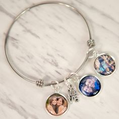 "Savor the Memories with this beautiful Personalized Photo Bracelet. This photo bracelet makes the perfect gift for Mom or Grandma this holiday season! This Photo Bracelet is available in silver or gold color and features: ♥ Stainless Steel Photo Charm Bracelet is approximately 2.55\" in diameter ♥ LOVE Charm ♥ Include up to 5 photos ♥ Ships fast! Photo Bracelet comes in a kraft box ready to give as a gift. -- SENDING PHOTOS -- After ordering please attach your photos to an etsy conversation or Personalized Round Charm Bracelet For Best Friend, Customizable Bracelets For Best Friend Gift On Valentine's Day, Customizable Bracelets For Best Friend On Valentine's Day, Charm Bracelet For Best Friend Gift On Valentine's Day, Customizable Adjustable Charm Bracelet For Best Friend, Valentine's Day Charm Bracelet For Best Friend, Nickel Free Charm Bangle For Personalized Gift, Nickel-free Bangle Charm Bracelet For Personalized Gift, Customizable Charm Bracelet For Valentine's Day Friendship