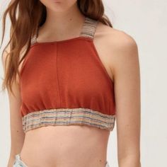 Nwot Urban Outfitters Ultra-Cropped Top In Rust Color Fitted With Stretchy Shoulder Straps That Cross At The Open Back High Neck Silhouette Trimmed With Stripped Elastic Band On The Straps And Bottom 60% Cotton 40% Polyester *Fits Like A Medium* Casual Cropped Halter Top With Stretch, Casual Cropped Stretch Halter Top, Casual Stretch Cropped Halter Top, Casual Brown Sleeveless Halter Top, Red Fitted Cropped Halter Top, Brown Cropped Summer Top, Brown Cotton Crop Top For Day Out, Casual Orange Sleeveless Halter Top, Red Spring Crop Halter Top