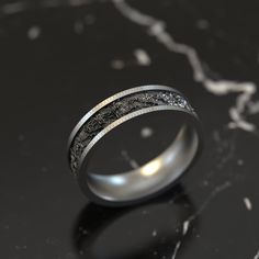 a wedding ring with an intricate design on it