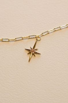 14k Gold filled North Star Charm to guide your way. This charm adds a bit of shine and fun shape to every necklace. Hand make your custom charm necklace in Laguna Beach or build your piece online through adding a base necklace and your selection of charms. Leave us a note on your order for any special requests. 14K gold filled Tarnish resistant 2.5 cm tall Everyday Star-shaped Jewelry With Charms, Yellow Gold Star Charm Pendant Necklace, 14k Gold Dainty Jewelry With Star Charm, Dainty 14k Gold Star Charm Jewelry, Gold Star-shaped Jewelry With Charms, Dainty Star-shaped Charms Jewelry, Dainty Star Shaped Charms Jewelry, Everyday Personalized Star-shaped Jewelry, Star-shaped Charm Necklaces For Gifts