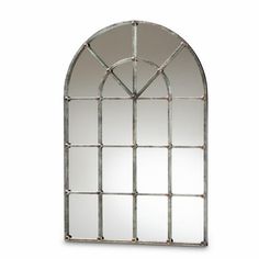 an arched metal mirror on a white background