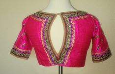 The color is a beautiful hot pink and the fabric, the pure raw silk which features delicate aari, zardosi and dabka hand-embroidery with bird motifs elevating the picturesque beauty of this blouse. Such a cheerful,  dainty hand-embroidery and a flattering silhouette  is totally out-of-the-world and one-of-a-kind. Grandeur that turns heads when you wear.  Backside keyhole neck style with hooks and button on the neck.  Size: 38" (has plenty of margin and will open upto 42") *I can get it downsized too upon request via DM for an additional cost* Padded blouse Traditional Pink Blouse Piece With Zari Work, Pink Blouse Piece With Dori Work In Traditional Drape, Pink Blouse Piece With Dori Work, Traditional Pink Silk Thread Choli, Pink Traditional Drape Blouse Piece With Dori Work, Designer Wear Pink Silk Thread Choli, Pink Blouse With Resham Embroidery In Traditional Drape, Pink Art Silk Blouse Piece With Dori Work, Traditional Pink Silk Thread Blouse Piece