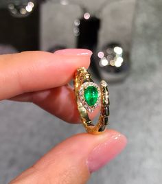 Model Number: ERD3PGX020 18K yellow gold plain snake ring Available: Yellow Gold and White Gold Metal Stamp: 18k AU750 Metals Type: 18K Gold Weight/g: 4.09 Stone: Material Emerald/ 1pc and Weight/ct 0.46 Side Stone: Diamond/1 8pcs and Weight/ct 0.12 Metal Color: Yellow Gold Setting Type: Prong Setting Gender: Unisex Fine Elegant Yellow Gold Open Snake Ring, Yellow Gold Snake-shaped 14k Gold Rings, Gold Fine Jewelry Snake-shaped Ring, Luxury Gemstone Snake Ring, Formal Yellow Gold Snake Ring, Luxury Yellow Gold Snake Shaped Ring, Fine Jewelry Anniversary Snake Ring In Oval Shape, Luxury Gold Snake Ring With Gemstone, Oval Snake Ring For Anniversary In Fine Jewelry