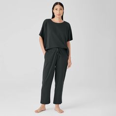 The relaxed lines of our slouchy pant. Ideal for lounging or sleeping, in soft organic cotton. Designed with versatility in mind—pair with one of our matching tops or mix and match. Comfy Bottoms With Relaxed Fit For Home Relaxation, Comfy Relaxed Fit Bottoms For Home, Relaxed Cotton Activewear For Relaxation, Comfy Relaxed Fit Bottoms For Relaxing At Home, Black Relaxed Fit Sweatpants For Relaxation, Relaxed Fit Pants For Relaxation, Comfortable Relaxed Fit Sweatpants For Sleep, Relaxed Fit Activewear For Lounging, Organic Cotton Pants With Elastic Waistband For Loungewear