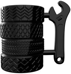 a black coffee mug with a wrench on the top and four cups stacked together