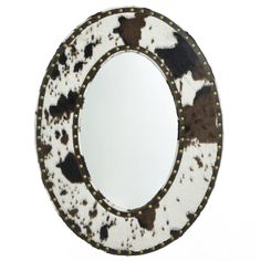 an animal print mirror is shown against a white background with gold studded trimmings