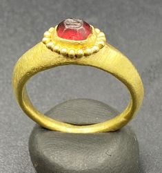 Ancient GREEK'S GOLD RING WITH GARNET STONE Signet Stamp. Beautiful Tree Leave Figure Is Engraved On Garnet Stamp Signet. Size And Details Pictures Are Listed Above. For Better View Of Stamp We Imprint The Stamp On Wax Clay As Shown In The Pictures. Gold Domed Ruby Ring With Gemstone, Gold Ruby Ring With Domed Shape, Luxury Gold Emerald Round Ring, Luxury Gold Emerald Ring, Fine Jewelry Cabochon Ruby Ring In Yellow Gold, 22k Gold Ruby Ring, Fine Jewelry Ruby Ring In Yellow Gold With Cabochon, Cabochon Ruby Ring In Yellow Gold, Gold Ruby Ring With Cabochon In 14k Gold