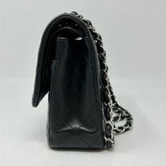 Chanel 2020 Classic Medium Double Flap Bag with Silver-tone Hardware and Turn-Lock at Front, Chain Link Shoulder Strap (Includes Authenticity Card, Seal, Dustbag) Est. Retail: $10,800, Minor Discoloration on Interior) Designer = Chanel Color = Black Material = Lamb Skin Condition = Good Height = 6 Width = 10 Depth = 2.5 Class = Premier Location: Chicago Item Number: 20559-10 Item ID: 302070 Category: Shoulder Bag Chanel Classic Medium, Chanel 2020, Skin Condition, Skin Conditions, Flap Bag, Item Number, Interior Designer, Chanel Classic, Chain Link