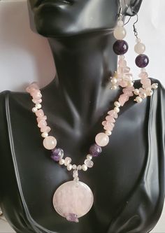 "Beautiful gemstone Amethyst and Rose Quartz that blend so well in colors of purple and pink. Amethyst has a cleansing energy and are known to instill feelings of understanding, calmness. Healing properties against negative energy. Rose Quartz is the stone of universal love. Purifies and opens the heart at all levels to promote self love, deep inner healing. Large Rose Quartz pendant measures 1.5' in diameter, 1/4' thickness, with Amethyst chip at the bottom of round pendant 2 large Amethyst pur Pink Amethyst Spiritual Jewelry, Round Purple Rose Quartz Jewelry, Purple Rose Quartz Round Jewelry, Purple Rose Quartz Gemstone Jewelry, Pink Natural Stones Crystals For Healing, Purple Rose Quartz Jewelry For Healing, Round Pink Natural Gemstones, Pink Amethyst Round Jewelry, Pink Jewelry For Meditation