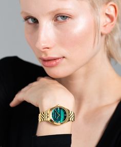 A classic design, elevated. The bold and urban Vivid watch features a statement round face with a chunky outer casing that’s juxtaposed by the decadent forest green face, minimalist numerals and crystal detailing. In sumptuous and stylized gold with a 32mm face, Vivid is a powerful piece pairing androgynous design with robust links made of gold-plated stainless steel for effortless sophistication. Modern Mom, British Heritage, Swedish Design, Earrings Collection, Metal Bracelets, Round Face, Forest Green, Classic Design, Timeless Elegance