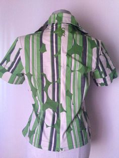 "Green Wrap Shirt, Japanese style 70s style with pointed collars Stunning patterned wrap blouse featuring green vertical stripes mixed with green circles and other abstract prints Wrap waist with button fastening Short sleeves, pointed collar, V-neckline, cotton fabric, low waist zipper Amazing combination of style! Asian bodice and collars with 70's references So cool abstract pattern, comfy fitting and absolutely trendy and hip looks! A unique 90's vintage piece, in great condition. ‼️Be aware Wrapped Blouse, Green Wrap, Wrap Shirt, Abstract Designs, 70s Style, Wrap Blouse, Vertical Stripes, 70s Fashion, Low Waist