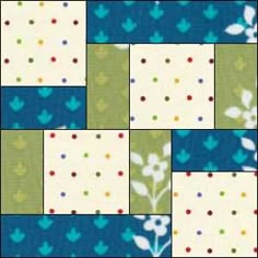 a patchwork quilt with blue, green and white flowers