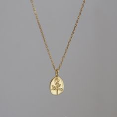 This dainty handmade necklace features a oval shaped signet pendant that has been engraved with exquisite rose flower. Gold and silver tone of your choice. Minimalism delicate design, makes it perfect for layering and stacking, adding a touch of sophistication to any of your outfit. It is also a amazing gift idea for for anyone who loves subtle modern aesthetics. Simple yet unique, elegant yet with attitude. 💎 Features: ♥ Handmade necklace ♥ Finish: 14K gold vermeil/925 sterling silver ♥ 17" + Minimalist Oval Pendant Necklaces For Mother's Day, Minimalist Oval Pendant Necklace For Mother's Day, Elegant Oval Pendant Necklaces With Flower Charm, Elegant Oval Pendant Necklace With Flower Charm, Dainty Oval Pendant Necklace For Mother's Day, Dainty Rose Design Flower-shaped Necklace, Dainty Rose Gold Oval Necklace, Dainty Oval Rose Gold Necklace, Minimalist Oval Rose Gold Necklace