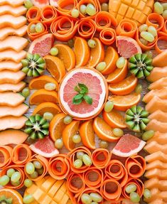 an assortment of fruits and vegetables are arranged together