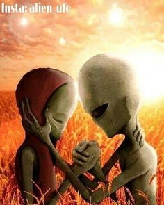 an alien couple standing in the middle of a field with their heads touching each other