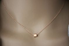 "Minimalist choker necklace, silver sterling pink gold plated with cube pendant - fine pink gold necklace - silver choker - silver cube necklace My rose gold jewelry is made with solid silver findings with 18k rose gold plating.  Necklace in pink gold silver minimalist style. Silver sterling chain with 4cm extension chain. Several lengths available. 1 silver pink gold cube bead 5mm is mounted on the chain. Do not hesitate to contact me if you want another length. ♦ All my jewelry is made to order according to the dimensions you have chosen. Please check your measurements carefully. ♦ My jewelry is also delivered \"ready to offer\" and packaged in a pretty gift bag. Sending neat. For further information, please feel free to contact me via the tab \"contact the creator\" (answer within 24 ho Minimalist Jewelry With Delicate Chain And Square Pendant, Minimalist Jewelry With Delicate Square Pendant, Minimalist Rose Gold Choker Jewelry, Minimalist Rose Gold Choker Necklace, Minimalist Rose Gold Charm Necklace With Delicate Chain, Dainty Rose Gold Necklace With Square Pendant, Rose Gold Necklace With Square Pendant For Gift, Rose Gold Square Pendant Necklace As Gift, Modern Rose Gold Necklaces As Gift