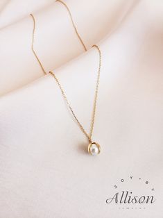 Pearls are used a lot in accessories as gemstones. It looks classy, timeless and elegant, and we agree! However, we try to bring pearl necklaces to a whole new level. Here we present you a necklace with a pendant you've never seen before. Our pendant shows a shell that is opened with a beautiful pearl inside. This is truly a one-of-a-kind piece.  This beautiful necklace is made of 925 sterling silver that is plated with 18K gold. The star of the pendant is a real, freshwater pearl. The length of the necklace is 40 cm while the pendant's length is 2.2 cm. Our jewelry comes with a pouch for safekeeping. A wonderful gift option for a lover, mother, or daughter. Show how much you care by giving them this amazing necklace. A beautiful piece to symbolize beauty, elegance, and class. Suitable for Elegant Rose Gold Charm Necklaces For Everyday, Minimalist Pendant Charm Necklace For Formal Occasions, Minimalist Pendant Charm Necklace For Formal Events, Minimalist Clavicle Chain Charm Necklace For Formal Occasions, Minimalist Formal Charm Necklace With Clavicle Chain, Minimalist Formal Charm Necklace With Clavicle Style, Minimalist Formal Pendant Charm Necklace, Formal Minimalist Round Pendant Charm Necklace, Minimalist Gold Plated Charm Necklace For Formal Occasions