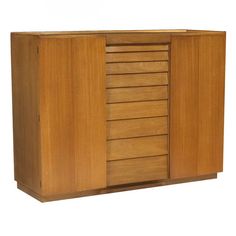 a large wooden cabinet with drawers and doors