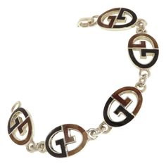 Gucci Sterling Silver Black Brown Enamel Iconic Bracelet Handcrafted in Italy For Sale at 1stDibs Gucci Sterling Silver Jewelry With Polished Finish, Designer Silver Gucci Jewelry, Vintage Gucci Gold Jewelry, Vintage Gold Gucci Jewelry, Luxury Silver Enamel Bracelets, Vintage Gucci Jewelry For Formal Occasions, Vintage Gucci Jewelry For Formal Events, Designer Black Metal Jewelry, Designer Enamel Jewelry With Polished Finish