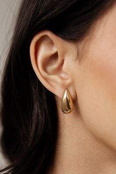 Elevate any outfit with these must-have Céline - gold teardrop stud earrings. As statement earrings, they provide an instant touch of sleek sophistication. These earrings are the perfect addition to any jewelry collection. MATERIAL: 18k PVD Gold plated Water resistant, tarnish resistant, hypoallergenic, & nickel/lead free. Modern Gold Teardrop Drop Earrings, Timeless Teardrop Tarnish-resistant Earrings, Modern Tarnish Resistant Teardrop Earrings For Formal Occasions, Yellow Gold Teardrop Hoop Earrings, Modern Durable Teardrop Earrings For Formal Events, Sleek Gold Earrings For Pierced Ears, Modern Gold Pear-shaped Teardrop Earrings, Chic Teardrop Earrings Tarnish Resistant, Modern Gold Teardrop Earrings For Formal Occasions