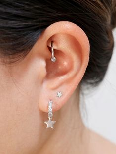 Dainty little stars dangle beneath pave cubic zirconia studded hoops. Half hoop studs make these easier to put on! Shown worn stacked with our 'micro make a wish' studs. • sterling silver posts, rhodium silver filled/22k gold filled focal & charm, cubic zirconia • hoops measure 11mm (just over 3/8") diameter, 19mm (3/4") length with drop• handmade in Toronto, Canada Tiny Star, Earrings Dainty, Jewelry Card, Star Jewelry, Huggie Hoop Earrings, Star Charms, 22k Gold, Silver Hoop Earrings, Charm Earrings