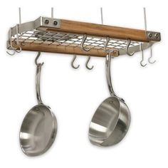 two pots and pans hanging from hooks on a rack with wooden handles, made out of metal