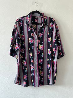 Oversized short sleeve printed button up tee. Unlined and in excellent vintage condition. DETAILSLabel: Royal DesignSIZE & MEASUREMENTSBest Fits: M/LLength: 32"Bust: 52"Waist: 50"Sleeve: 10"Shoulder: 26" Vintage Short Sleeve Shirt With Camp Collar For Spring, Casual Collared Blouse With Vintage Print, Vintage Print Short Sleeve Hawaiian Shirt For Spring, Spring Vintage Print Hawaiian Shirt With Short Sleeves, Vintage Print Hawaiian Shirt For Spring, Graphic Print Short Sleeve Tops For Daywear, Vintage Multicolor Tops For Daywear, Retro Patterned Short Sleeve Tops, Multicolor Hawaiian Shirt With Button Closure