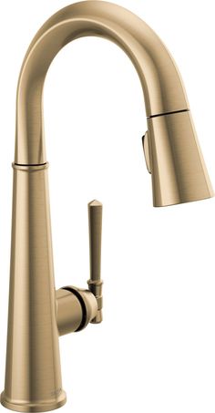 a kitchen faucet with the pull out sprayer in brushed brass finish, on an isolated white background