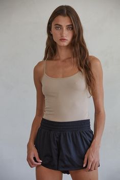 Introducing the ideal combination of style and practicality of our Margaret Basic Tank! Made with premium seamless cami and a hint of spandex, this tank top offers the perfect amount of stretch for everyday comfort. Upgrade your wardrobe with top-notch quality now! 92% Nylon, 8% Spandex Care Notes Hand Wash Cold with Like Colors Do Not Bleach Flat to Dry Do Not Iron Size & Fit HPS Length: (SM) 17 1/4", (ML) 17 3/4" Chest: (SM) 13 1/8", (ML) 14 1/8" Sweep: (SM) 13", (ML) 14" Scarf Belt, Black Camis, Custom Bridal, Dress Trousers, Jean Leggings, Staple Pieces, Basic Tank, Sweater Jacket, Dress Pants