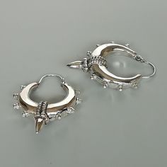 A PAIR of chunky ethnic style sterling silver spike hoops. Dimensions: Length (with spike) 33mm Width: (with spike) 25 mm Weight: 10.8 gm Price listed is for a PAIR of hoops. These earrings are made of 925 hypoallergenic sterling silver Can be packaged in a gift box. I can include a personal message from you if needed You are welcome to contact me at... bhavnakwintra1956@gmail.com For more beautiful pieces from my shop, please browse 👇 TOE RINGS: https://www.etsy.com/your/shops/TheSilverGame/to Hoop Earrings Chunky, Egyptian Jewelry, Ethnic Style, Sterling Silver Hoops, Toe Rings, Silver Hoops, Personal Message, Bali, Silver Rings