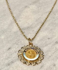 "Ornate Version , beautiful pendant Spanish \"Mi Primera Comunion\" 14K yellow gold, solid, written \"Mi Primera Comunion\" -In stock, ships within 1-2 business days -solid 14k yellow gold, not plated or gold filled. -approximately 3/4 Inch in diameter -Perfect for special gift for first commuion -ideal for both gender Communion -ideal for a special gift -ideal size to be medium sized style charm -14K yellow gold (photograph in 14K yellow gold) Chain A: Dainty cable style chain in 14K yellow gol Formal Yellow Gold Jewelry With Coin Pendant, Gold Round Medallion Necklace For Anniversary, Heirloom Gold Engraved Jewelry, Gold Medallion Necklace For Anniversary, Fine Jewelry Round Pendant Necklace Stamped 14k, 14k Gold Necklace With Round Pendant, Engraved Heirloom Gold Jewelry, 14k Yellow Gold Round Pendant Necklace, Gold Heirloom Medallion Jewelry