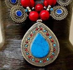 Since this is an older piece, I am open to considering reasonable best offers. Please email me. _____________________________________________________________________________________________ This stunning, jaw drop creation is from my private vault, and unworn. It is a big, bold, chunky and heavy beaded chest piece comprised of red, blue and green magnesite round beads with shiny silver tone metal balls. 12 lapis lazuli fancy filigree charms are suspended from the outer most strand and a blue and Red Bohemian Necklace With Large Pendant, Artisan Red Beaded Necklaces For Festivals, Artisan Red Beaded Necklace For Festivals, Handmade Red Beaded Necklaces For Festivals, Red Bohemian Jewelry With Intricate Design, Traditional Red Pendant Beaded Necklace, Traditional Beaded Necklaces With Gemstone Beads For Festival, Traditional Red Beaded Pendant Necklace, Traditional Gemstone Beaded Necklace For Festivals