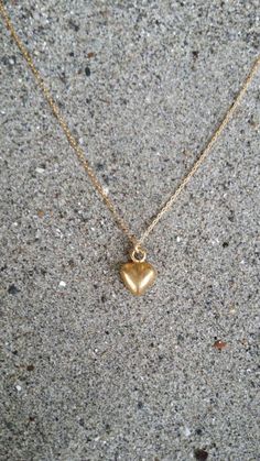 Tiny heart pendant. So cute and dainty can be worn every day with everything!The matte gold plated charm is a dainty 10mm long with a matte gold finish. It  has a delicate 14K gold fill chain with a gold filled clasp in back. Shown here in 17" length.*If you are unsure of the length you need, or would like to wear this item at different lengths, we now offer an adjustable length option! You can add an adjustable end to your necklace using this link: https://www.etsy.com/listing/791277751/necklac Cheap Delicate Chain Jewelry With Heart Pendant, Cheap Gold Heart Necklace Gift, Cheap Minimalist Heart Charm Necklaces, Cheap Minimalist Heart Pendant Necklace, Simple Everyday Charm Necklace With Heart, Simple Everyday Heart Charm Necklace, Simple Gold Charm Necklace For Valentine's Day, Everyday 14k Yellow Gold Filled Heart Necklace, Simple Gold Charm Necklaces With Heart Pendant