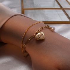 "Adorn yourself or your bridesmaids with our Personalized Mother of Pearl Bracelet. With a heart charm and minimalist design, it's a heartfelt and stylish jewelry gift. Embrace elegance and sentimentality with our customizable bracelet. #YOU MAY LIKE THIS Dainty rose gold slider bracelet https://www.etsy.com/listing/1486513550/dainty-rose-gold-slider-bracelet Engraved Paperclip Silver Heart Bracelet https://www.etsy.com/listing/1497885357/engraved-paperclip-silver-heart-bracelet # HOW TO ORDER 1 Minimalist Bridesmaid, Bridesmaid Jewelry Gift, Shiny Bracelets, Mother Of Pearl Bracelet, Pearl Charm Bracelet, Gold Pearl Bracelet, Pearl Bracelet Gold, Dainty Rose, Engraved Bar Necklace