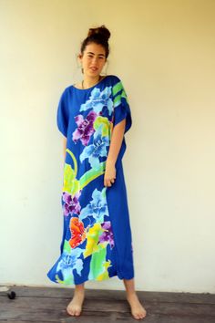 "Beautiful vintage 70s-80s tropical caftan dress in blue colorful floral and butterfly print in green purple orange and yellow, easy fit and very comfortable. perfect dress for summer or beach cover. not sure of the fabric, possibly Rayon soft and lightweight. aside from minor signs of wear, very good vintage condition, clean, ready to wear. ** Model is 5'8\" and size S ** / bust: 34\" / waist: 24\" / hips: 37\" Approximate size: O.S - please refer to the measurements M E A S U R E M E N T S -we Vintage Blue Maxi Dress For Vacation, Tropical Blue Maxi Dress For Beach, Blue Hawaiian Maxi Dress With Floral Print, Vibrant Short Sleeve Beach Maxi Dress, Vibrant Blue Floral Print Maxi Dress, Vibrant Short Sleeve Maxi Dress For Beach, Vibrant Short Sleeve Maxi Dress For The Beach, Green Cotton Dress, Beach Caftan