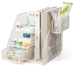 a white desk organizer with pens, markers and pencils