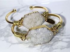 Perfect gifts for moms, birthdays, graduations and especially bridesmaids gifts!  My  unique handcrafted bracelets are the perfect accessory to any outfit.  These can be worn alone, but in my book, the more, the merrier!   *Natural Druzy gemstone  *18k Gold plated cuff *Wire wrap All my bracelets will have a slight variation due to the unique nature of the gemstones, so no two bracelets are ever 100% alike!   Each bracelet comes in its own pouch.  Great for keeping them in a safe and secure place, especially when traveling! Thank you for supporting a mom and her dreams ;) Follow me on Instagram and say hi @ instagram.com/samandgracejewelry Bridal Cuff Bracelet, Cuff Bracelet Gold, The More The Merrier, Druzy Bracelet, Gifts For Moms, Gold Cuff Bracelet, Jewelry Bridesmaid, Handcrafted Bracelets, Wedding Boho