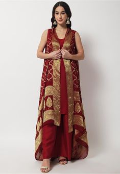 Readymade Art Silk Straight Kurta in Maroon This Sleeveless and Round Neck attire with cotton Lining is Woven Ornamental Motifs Available with a Art Silk Palazzo in Maroon and Faux Georgette Jacquard Shrug in Maroon Do Note: Accessories shown in the image are for presentation purposes only and length may vary upto 2 inches.(Slight variation in actual color vs. image is possible). Luxury Red Kurta For Festivals, Luxury Cotton Silk Set With Zari Weaving, Luxury Slub Silk Set With Zari Weaving, Brocade Suits, Silk Cape, Embroidered Kurti, A Line Kurta, Silk Bottoms, Silk Suit