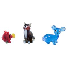 three small plastic animals sitting next to each other