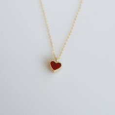 Tiny and dainty red agate heart filled with love and passion, such a perfect present for Valentine's Day and your loved ones. :: Style name: RDHRT-ENLN1034 :: Heart size: 7x7.5mm :: Material: 14k solid yellow gold :: Stone type: red agate Notes :: Jewelries are measured in millimeters and centimeters. :: Please read store policy before placing order. :: In stock items are ready to ship in 3 business days, made to order items are ready to ship in 2-4 weeks. :: International Shipping AVAILABLE. :: Red Dainty Jewelry For Mother's Day, Elegant Red Jewelry With Heart Charm, Red Heart Charm Fine Jewelry, Red Fine Jewelry With Heart Charm, 14k Gold Charm Necklace For Valentine's Day Gift, Dainty Red Charm Necklace For Valentine's Day, Dainty Red Necklace As Gift For Her, Dainty Red Necklace For Her, Dainty Red Necklace For Anniversary