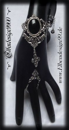 A very beautiful Gothic-style hand jewellery, which, like all my jewellery, was made with great care and attention to detail. The bracelet is made of silver plated metal components with black onyx and black diamond rhinestones. adjustable for an arm circumference of approx. 15-21 cm. Silver Gothic Jewelry For Fantasy Events, Gothic Metal Jewelry For Fantasy Events, Gothic Antique Silver Jewelry With Intricate Design, Gothic Sterling Silver Jewelry With Intricate Design, Gothic Nickel-free Jewelry For Weddings, Gothic Nickel-free Wedding Jewelry, Gothic Silver Metal Body Jewelry, Silver Gothic Metal Body Jewelry, Silver Gothic Body Jewelry