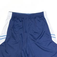 Item is in good used condition. > Size: L > Waist Size: 30" > Inside Leg: 9" > Rise: 13" > Hem: 13" Navy Sportswear Shorts For Gym, Navy Sports Shorts With Built-in Liner, Navy Athletic Shorts For Sports, Blue Athletic Shorts For Sports Events, Navy Moisture-wicking Sportswear Shorts, Blue Sporty Athletic Shorts For Workout, Blue Moisture-wicking Shorts, Navy Sports Shorts With Elastic Waistband, Navy Athletic Shorts With Elastic Waistband For Sports