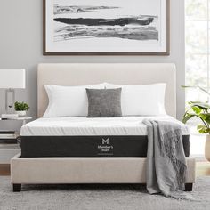 an image of a bedroom setting with the mattress on it's side and pillows on the bed