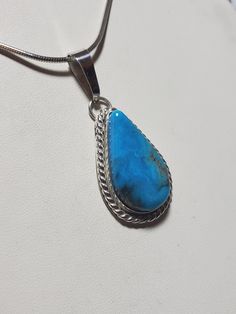 Blue Basin Turquoise pendant.  This came from the Kingman mine in the rough.  I cut and polished the stone.  It is of high quality, blue with black matrix, perfect color combination. This is genuine turquoise.   Turquoise has been used for hundreds of years.  A great gem stone. I guarantee my products. Turquoise is set in the new tarnish resistant Argentium silver. Will be gift wrappeded I ship by USPS priority mail.  I ship in the US and to Canada. Thank you for shopping at GarysJewelry.  I appreciate it. Please contact me if I can answer a question relating to my jewelry.  Thanks Artisan Blue Turquoise Necklace Untreated, Untreated Oval Blue Turquoise Necklace, Blue Turquoise Necklace With Large Teardrop Stone, Turquoise Teardrop Necklace With Large Stone, Turquoise Necklace With Large Chrysocolla Pendant, Blue Turquoise Necklace With Large Chrysocolla Pendant, Artisan Blue Turquoise Teardrop Pendant Necklace, Blue Turquoise Chrysocolla Necklace With Large Pendant, Hand-strung Turquoise Pendant Jewelry