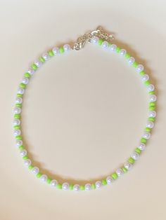 Cute, summery, fun, trendy, adjustable, lime green bead pearl choker. Length: 13.5-16 in. Custom sizes available. Handcrafted. Green Spring Beach Jewelry, Trendy Green Beaded Necklace For Gift, Green Handmade Pearl Necklace, Casual Green Choker Jewelry, Casual Green Choker Necklace, Adjustable Green Choker Necklace, Trendy Green Beaded Choker, Trendy Handmade Green Necklaces, Trendy Summer Round Beads Choker