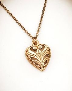 Necklace.  New 1970s vintage 14k gold plated heart pendant.  Scroll design.  Beautiful gift for the Dainty Heart Pendant Jewelry With Vintage Charm, Elegant Charm Necklaces With Vintage Charm As Gift, Heart Pendant Necklace With Vintage Charm For Anniversary, Elegant Heart Necklace With Vintage Charm As Gift, Vintage Rose Gold Necklaces For Mother's Day, Elegant Filigree Heart Necklace As A Gift, Anniversary Heart Pendant Necklace With Vintage Charm, Vintage Charm Heart Pendant Necklace For Anniversary, Vintage Rose Gold Necklace For Mother's Day