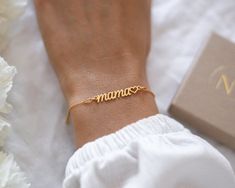 This gorgeous mama bracelet is available in silver or gold and features a 925 sterling silver 'Mama' script connector and a 925 sterling silver adjustable chain. D E T A I L S - available in 925 sterling silver or 24k gold plated- eco-friendly jewelry box with foiled pressed NJ Studio logo- no receipt included - gift-giving ready!- nickel freeS I Z E∙ bracelet is adjustable from 7 in to 8.2 in ∙ length 7 in (18 cm) + 1.2 in (3 cm) adjustable chain = maximum length 8.2 in (21 cm)P E R S O N A L I Mothers Day Jewelry Gifts, Trendy Mom Bracelet, Mother's Day Gold Charm Bracelet For Mom, Mother’s Day Braclet, New Mum Bracelet, Pod Jewelry, Mum Bracelet, Mama Jewelry, Mother Bracelet