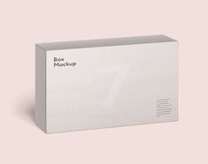 a white box with the number seven on it sitting in front of a pink background