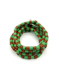 Ileke Ifa, Eleke Ifa, Otutu Opon . Ifa bracelet used by all ifa devotees in Yoruba land of southwest Nigeria Traditional Green Round Bead Bracelets, Traditional Green Bracelets With Round Beads, Traditional Green Hand Wrapped Bracelets, Traditional Brown Beaded Bracelets For Beach, Traditional Green Bracelets With Large Beads, Traditional Green Bracelet With Large Beads, Traditional Green Beaded Bracelets With Spacer Beads, Green Bead Bracelet For Festivals, Unique Green Wooden Beaded Bracelets