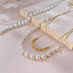 ✦ For a timeless and elegant look in your jewelry, try this Dainty Pearl Beads Layering Chain Necklace. Pairing double-layered pearls with delicate beads, this necklace is perfect for everyday wear and is resistant to tarnishing. Receive daily compliments with this minimal and refined necklace. ----------- DETAILS ----------- - Color: Gold/ Silver - Chain Length: 36.5cm + 6cm - Materials: Gold Plated, 316L Stainless Steel, Faux Pearl *316L Stainless Steel is hypoallergenic, generally safe for sensitive skin. - SKU: GX2309 Elegant Pearl White Beaded Necklace With Clavicle Chain, Elegant Pearl Necklace For Layering With Round Beads, Elegant Pearl Necklace For Layering, Layering Beaded Pearl Necklaces, White Chain Necklace With Pearl Pendant And Round Beads, White Pearl Layering Necklaces, White Pearl Chain Necklace With Round Beads, Classic White Beaded Chain Necklace, Double Strand Pearl Chain Beaded Necklaces For Layering